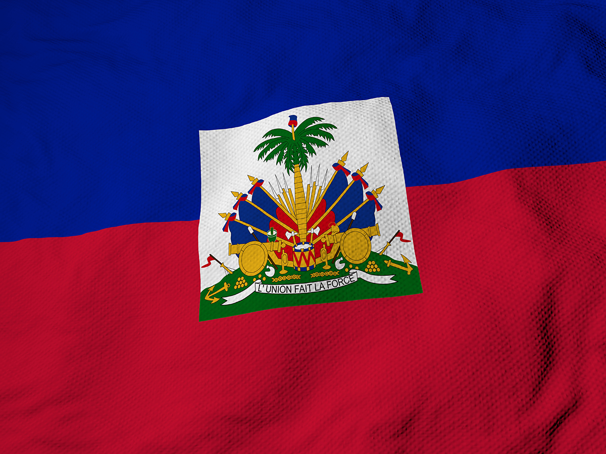Full frame close-up on a waving Flag of Haiti in 3D rendering.